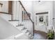 Welcoming entryway featuring hardwood floors and staircase with white railings at 180 Long Grass Dr, Smithfield, NC 27577