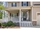 Inviting front entrance with a covered porch and decorative wreath on the door at 180 Long Grass Dr, Smithfield, NC 27577