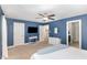 Comfortable bedroom showing blue walls, ample closet space, and neutral-colored carpet at 180 Long Grass Dr, Smithfield, NC 27577