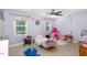 Charming bedroom featuring playful decor, a ceiling fan, and lots of natural light at 180 Long Grass Dr, Smithfield, NC 27577