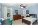 Blue bedroom with a ceiling fan, dresser, and a comfortable bed, perfect for a or teenager at 180 Long Grass Dr, Smithfield, NC 27577