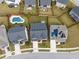 An aerial view showcasing multiple homes with fences, pools, driveways and landscaping at 1816 Sandoval Dr, Durham, NC 27703