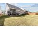 Home has a deck and a lawn that goes to a wooden fence at 1816 Sandoval Dr, Durham, NC 27703