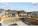 View of the backyard showing the home's wooden deck, fence, and outdoor grill at 1816 Sandoval Dr, Durham, NC 27703