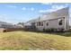 Backyard of home has deck, lawn and mature trees at 1816 Sandoval Dr, Durham, NC 27703