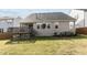 Backyard featuring a deck, mature trees and lawn at 1816 Sandoval Dr, Durham, NC 27703