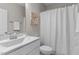 Clean, well-lit bathroom featuring a white vanity, marble countertop, and a shower at 1816 Sandoval Dr, Durham, NC 27703