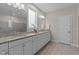 Bright bathroom featuring double sinks, modern cabinetry and a large mirror at 1816 Sandoval Dr, Durham, NC 27703