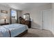 Comfortable bedroom with a dresser, carpet, and plenty of natural light at 1816 Sandoval Dr, Durham, NC 27703
