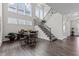 Elegant dining room with tall ceilings, an abundance of natural light, and a stairway to the second floor at 1816 Sandoval Dr, Durham, NC 27703