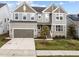 Charming two-story home featuring a mix of siding and stone accents, a two-car garage, and a well-manicured front yard at 1816 Sandoval Dr, Durham, NC 27703