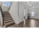 Welcoming hallway with hardwood floors, staircase, and decorative lighting at 1816 Sandoval Dr, Durham, NC 27703
