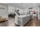 Modern kitchen featuring a large island with stone countertops, stainless appliances and open views at 1816 Sandoval Dr, Durham, NC 27703