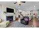 Inviting living room with a fireplace, TV, an open floor plan and seamless access to the kitchen at 1816 Sandoval Dr, Durham, NC 27703