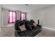Well-appointed media room featuring leather seating, accent pillows and a large screen for cinematic viewing at 1816 Sandoval Dr, Durham, NC 27703
