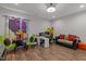 Office featuring laminate floors, couch, table and chairs, desk and shelving at 1816 Sandoval Dr, Durham, NC 27703