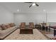 Spacious recreation room features a comfortable seating area, dark wood floors, and table at 1816 Sandoval Dr, Durham, NC 27703