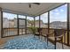 Relaxing screened porch with outdoor seating, a decorative rug, and wooded backyard views at 1816 Sandoval Dr, Durham, NC 27703