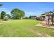 Large backyard with a boat, trampoline, and playset providing lots of space for activities at 182 Jesse Dr, Smithfield, NC 27577