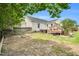 Secluded backyard featuring a hot tub, hammock, and deck, ideal for relaxation and privacy at 182 Jesse Dr, Smithfield, NC 27577