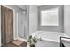 Bright bathroom showcasing glass enclosed shower and separate soaking tub at 182 Jesse Dr, Smithfield, NC 27577