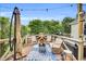Inviting deck with stylish outdoor furniture, including a fire pit, perfect for relaxing and entertaining at 182 Jesse Dr, Smithfield, NC 27577