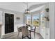 Cozy dining area with modern lighting, a round table, and a view of the backyard at 182 Jesse Dr, Smithfield, NC 27577