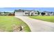 Single-story home featuring an attached garage and a long driveway leading to the residence at 182 Jesse Dr, Smithfield, NC 27577