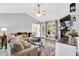 Cozy living room featuring vaulted ceilings, a ceiling fan, and a view of the patio at 182 Jesse Dr, Smithfield, NC 27577