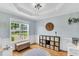 Bright playroom featuring a tray ceiling, large window, and organized storage at 182 Jesse Dr, Smithfield, NC 27577