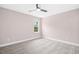 Cozy bedroom with carpet flooring, window for natural light, ceiling fan, and neutral walls at 185 Millwood Dr, Clayton, NC 27527