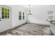 Bright dining area with stylish light fixture and outdoor access at 185 Millwood Dr, Clayton, NC 27527