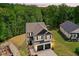 Stunning exterior view of a two-story home with a two-car garage, beautiful landscaping, and a lush green lawn at 185 Millwood Dr, Clayton, NC 27527