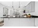 Bright kitchen featuring stainless steel appliances and neutral colored cabinets at 185 Millwood Dr, Clayton, NC 27527