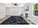 Bright living room boasts hardwood floors, fireplace, ceiling fan and plenty of space at 185 Millwood Dr, Clayton, NC 27527