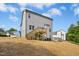 Two-story home with a wooden deck and stairs leading down to the backyard at 185 Millwood Dr, Clayton, NC 27527