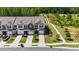 Aerial view of the front of multiple townhomes, showcasing landscaping at 191 Enterprise Dr, Clayton, NC 27520