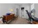Bedroom that is currently being used as a gym and an office space with natural lighting at 191 Enterprise Dr, Clayton, NC 27520
