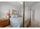 This bedroom features neutral walls, carpeted floor, and an inviting bed dressed with stylish patterned bedding at 191 Enterprise Dr, Clayton, NC 27520