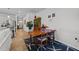 The dining area features a wooden table, stylish rug, and access to the kitchen and living room at 191 Enterprise Dr, Clayton, NC 27520