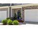 Inviting front entrance with stylish landscaping, a stone facade, and a secure ADT system at 191 Enterprise Dr, Clayton, NC 27520