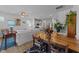Open-concept living room and kitchen featuring stainless steel appliances and hardwood floors at 191 Enterprise Dr, Clayton, NC 27520