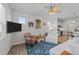 Cozy living room with hardwood floors, a ceiling fan, and natural light at 191 Enterprise Dr, Clayton, NC 27520