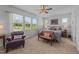 Main bedroom with carpet, ceiling fan, and natural light from surrounding windows at 191 Enterprise Dr, Clayton, NC 27520