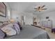 The main bedroom features plush carpet, neutral colors, and a ceiling fan at 191 Enterprise Dr, Clayton, NC 27520