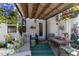 Charming covered patio with comfortable seating, colorful decor, and a cozy ambiance for relaxing outdoors at 191 Enterprise Dr, Clayton, NC 27520
