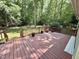 A wooden deck overlooking the green backyard at 192 Misty Hollow Rd, Timberlake, NC 27583