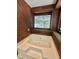 Close-up of a clean bathtub with wood trim and natural light streaming through the window at 192 Misty Hollow Rd, Timberlake, NC 27583