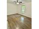 Bedroom with hardwood floors, a ceiling fan, and a window at 192 Misty Hollow Rd, Timberlake, NC 27583