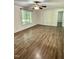 Bright living room featuring luxury vinyl plank flooring and a ceiling fan with light at 192 Misty Hollow Rd, Timberlake, NC 27583